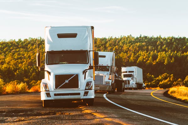 Fleet of delivery trucks on the road